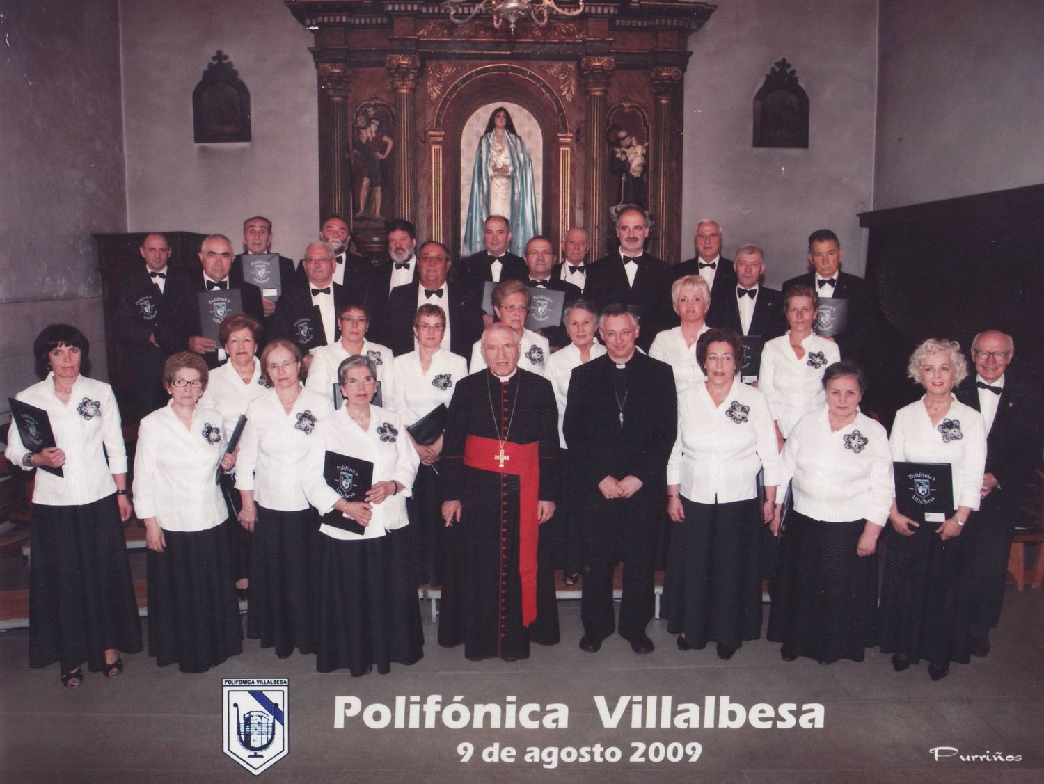 2009: A Polifónica de Vilalba con Don Uxío, Director; e os vilalbeses Monseñor Alfonso Carrasco Rouco, Bispo de Lugo, e o Cardenal Antonio María Rouco Varela.